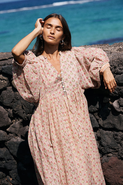 Bhoomi Maxi Dress Sunset — billowed sleeve detail against stone wall, hand block print cotton | Daughters of India