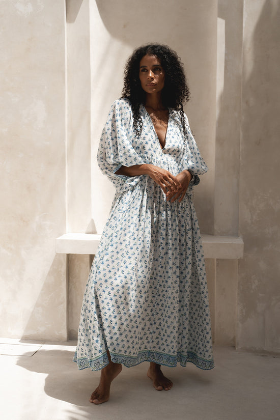 Daughters of India Kyra Maxi Dress in Azure — full length front view against cream wall, blue floral block print cotton