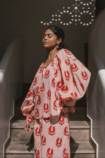 Ria Blouse Cherry Blossom — outdoor lifestyle portrait, model in natural setting, cherry blossom pink block print cotton blouse, Jaipur artisan made | Daughters of India